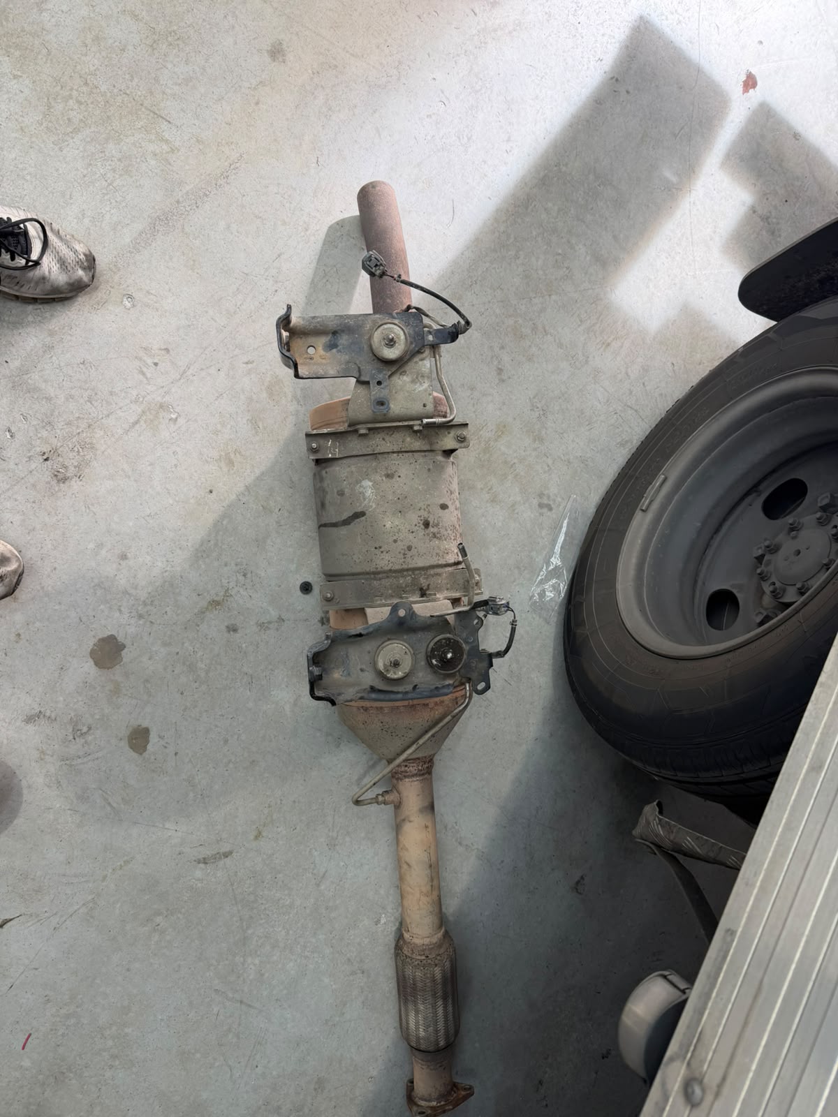 Removed diesel particulate filter and exhaust assembly